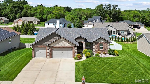 8743 Cardinal Creek Dr, Saint Jacob, IL 62281 - view of front of property with concrete driveway, a garage, brick siding, and stone siding