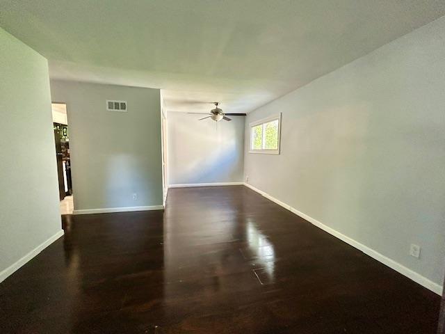 1157 June Ave, Saint Louis, MO 63138 - unfurnished room featuring baseboards, wood finished floors, and ceiling fan