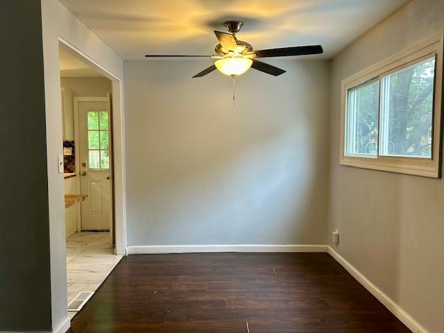 1157 June Ave, Saint Louis, MO 63138 - spare room featuring wood finished floors, ceiling fan, and baseboards