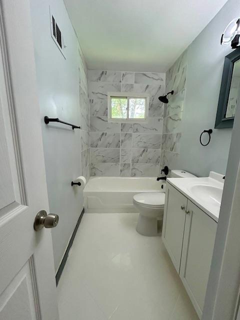 1157 June Ave, Saint Louis, MO 63138 - full bath featuring vanity, toilet, and bathing tub / shower combination