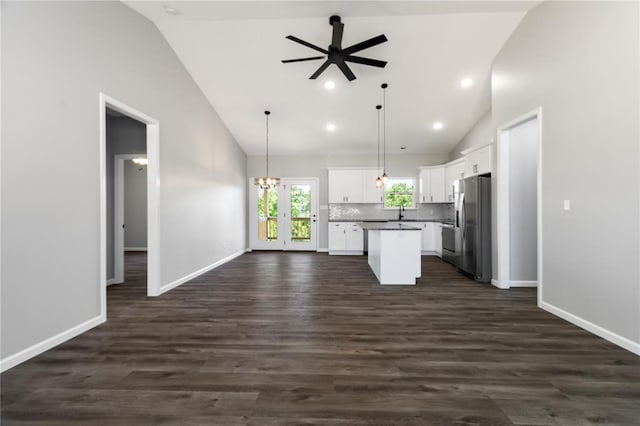 14682 N State Highway 21, Cadet, MO 63630 - kitchen with open floor plan, freestanding refrigerator, ceiling fan, a kitchen island, and white cabinetry