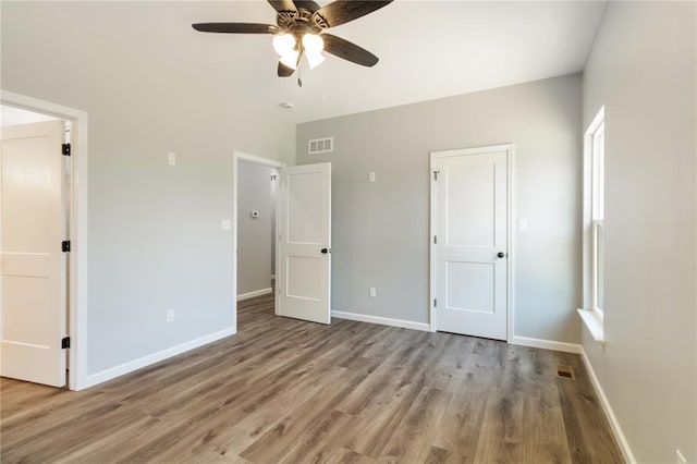 14682 N State Highway 21, Cadet, MO 63630 - unfurnished bedroom with wood finished floors, baseboards, and ceiling fan