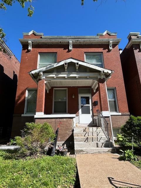 4528 Adelaide, Saint Louis, MO 63115 - view of front of house featuring brick siding and a porch