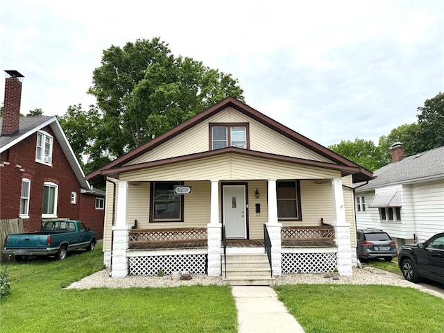 1106 Raab Ave, Belleville, IL 62220 - view of front of house featuring a porch and a front lawn
