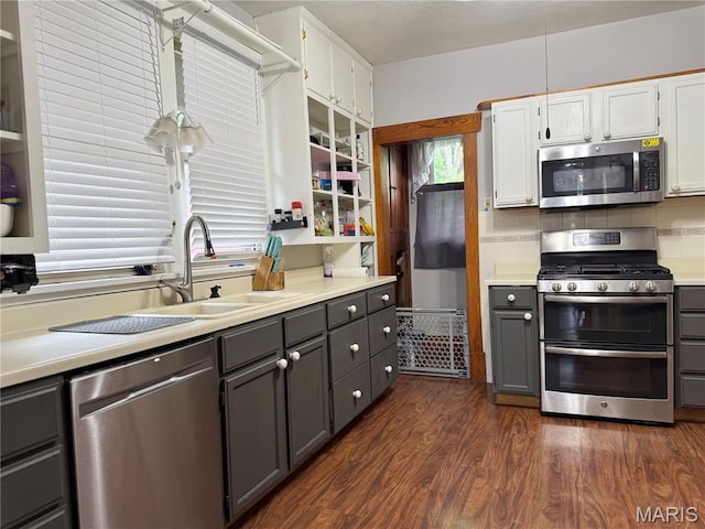 1106 Raab Ave, Belleville, IL 62220 - kitchen featuring stainless steel appliances, gray cabinetry, a sink, and dark wood-style flooring