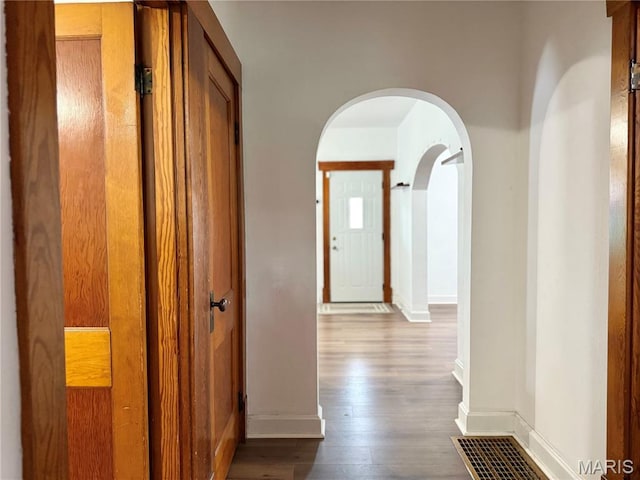 1106 Raab Ave, Belleville, IL 62220 - hallway with arched walkways, baseboards, and dark wood-style floors