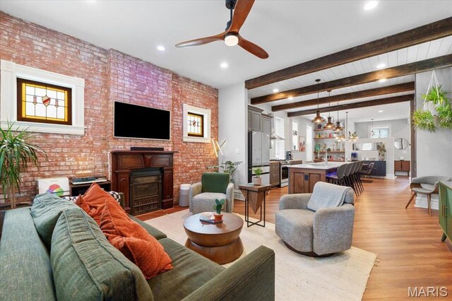 2000 Withnell Ave, Saint Louis, MO 63118 - living room featuring a fireplace, a ceiling fan, recessed lighting, light wood finished floors, and brick wall