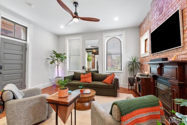 2000 Withnell Ave, Saint Louis, MO 63118 - living room featuring ceiling fan, wood finished floors, baseboards, a fireplace, and recessed lighting