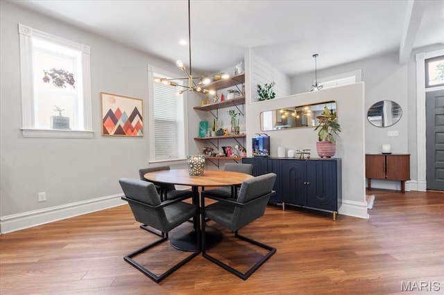2000 Withnell Ave, Saint Louis, MO 63118 - dining area featuring wood finished floors, baseboards, and a chandelier
