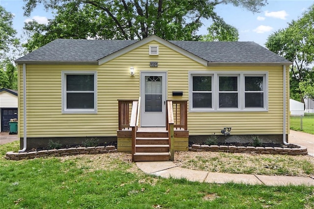 1901 Bainbridge Dr, Saint Louis, MO 63133 - view of front of home with a shingled roof and a front lawn