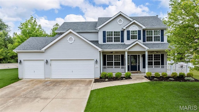 102 Riparian Dr, Ofallon, MO 63368 - view of front facade with a porch, concrete driveway, a front lawn, and a garage