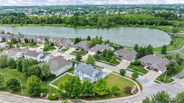 102 Riparian Dr, Ofallon, MO 63368 - aerial view of residential area with a large body of water and a tree filled landscape