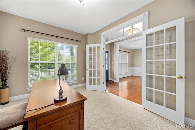 102 Riparian Dr, Ofallon, MO 63368 - carpeted home office with french doors, baseboards, and wainscoting