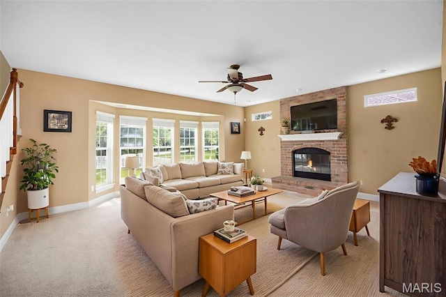 102 Riparian Dr, Ofallon, MO 63368 - living room with ceiling fan, plenty of natural light, baseboards, and a fireplace