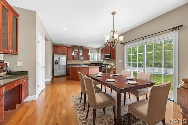 102 Riparian Dr, Ofallon, MO 63368 - dining space featuring a chandelier, light wood-style floors, baseboards, and recessed lighting
