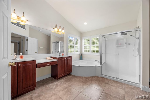 102 Riparian Dr, Ofallon, MO 63368 - bathroom with a garden tub, a stall shower, vanity, vaulted ceiling, and tile patterned floors