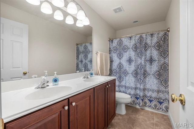 102 Riparian Dr, Ofallon, MO 63368 - full bathroom with double vanity, toilet, and tile patterned flooring