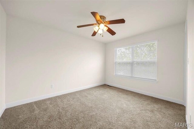 102 Riparian Dr, Ofallon, MO 63368 - carpeted spare room with baseboards and ceiling fan