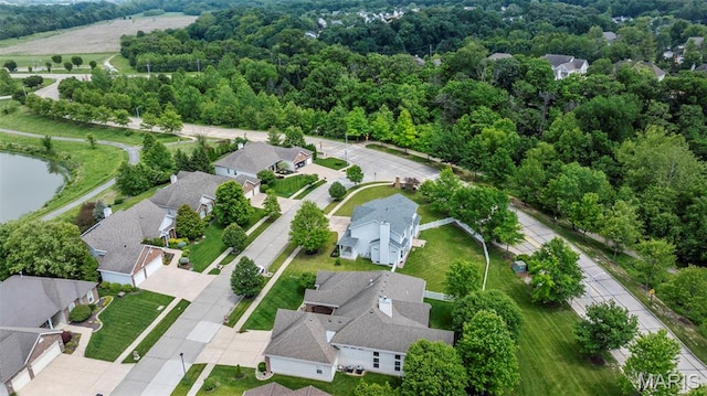 102 Riparian Dr, Ofallon, MO 63368 - aerial view of property's location featuring nearby suburban area and a forest