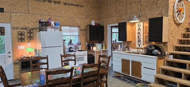 11117 Delbridge Rd, Potosi, MO 63664 - kitchen featuring white appliances, a sink, light countertops, and concrete floors