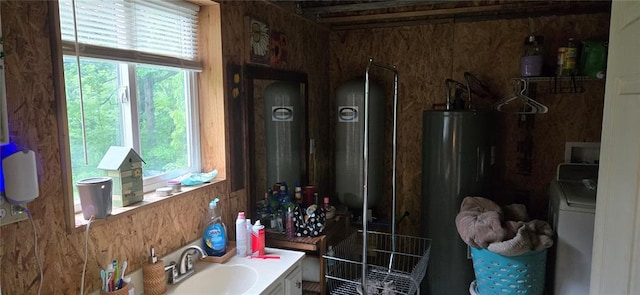 11117 Delbridge Rd, Potosi, MO 63664 - bathroom featuring water heater, vanity, and washer / dryer