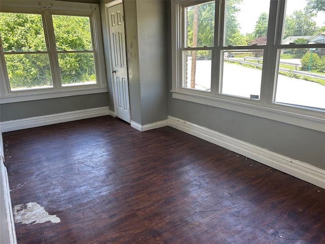 3838 Avondale Ave, Northwoods, MO 63121 - spare room with baseboards and dark wood finished floors