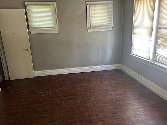 3838 Avondale Ave, Northwoods, MO 63121 - spare room with wood finished floors and baseboards