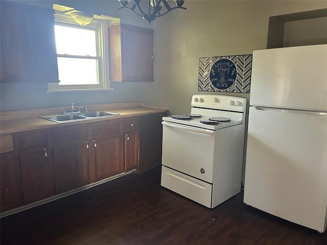 3838 Avondale Ave, Northwoods, MO 63121 - kitchen with white appliances, a sink, dark wood-type flooring, and light countertops