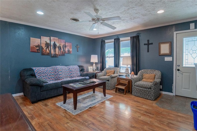 606 N Charles Ave, St James, MO 65559 - living area with crown molding, a textured ceiling, light wood finished floors, a ceiling fan, and a textured wall
