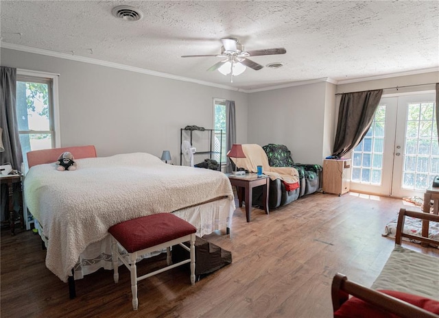 606 N Charles Ave, St James, MO 65559 - bedroom featuring access to outside, a textured ceiling, wood finished floors, multiple windows, and ornamental molding