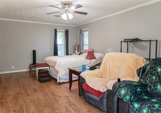 606 N Charles Ave, St James, MO 65559 - bedroom featuring wood finished floors, ornamental molding, ceiling fan, baseboards, and a textured ceiling
