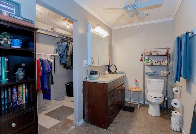606 N Charles Ave, St James, MO 65559 - full bathroom featuring a ceiling fan, vanity, toilet, crown molding, and a walk in closet