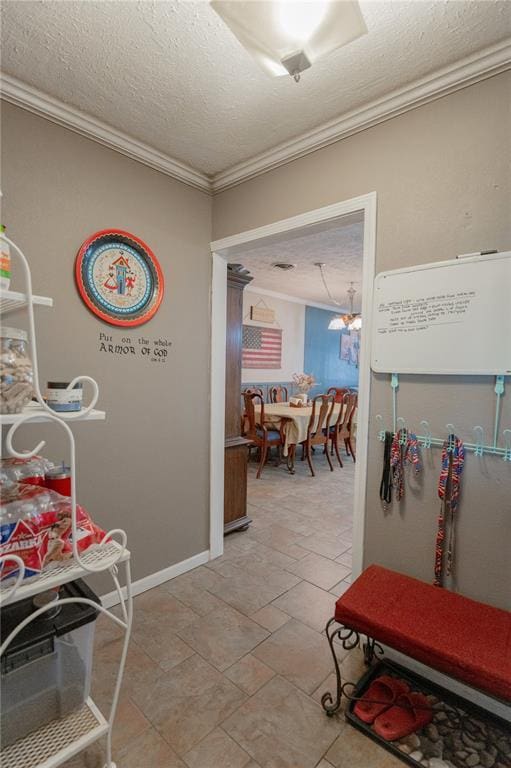 606 N Charles Ave, St James, MO 65559 - hallway featuring ornamental molding, a textured ceiling, baseboards, and light stone finish floors