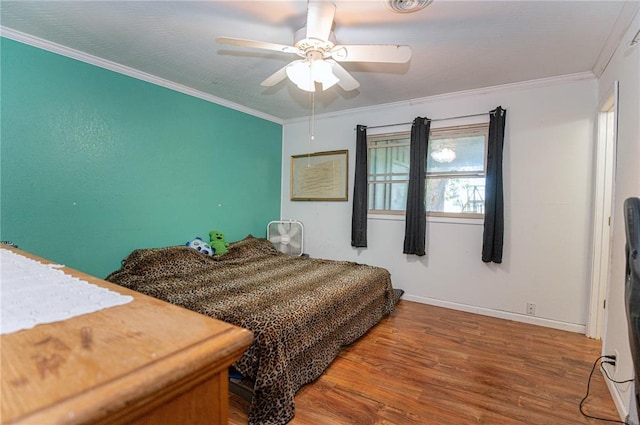 606 N Charles Ave, St James, MO 65559 - bedroom featuring wood finished floors, crown molding, baseboards, and a ceiling fan