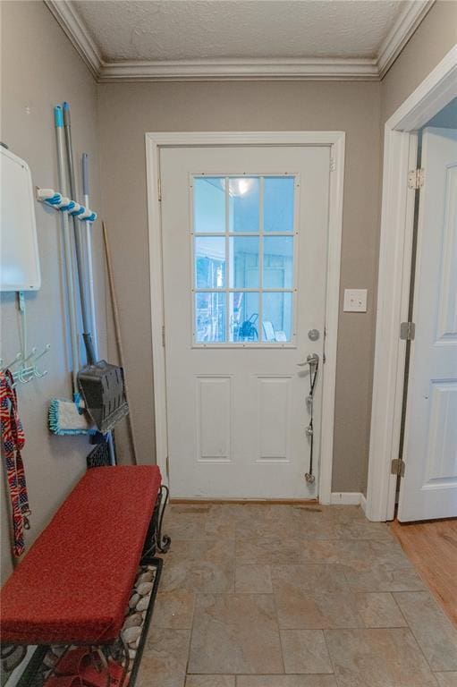 606 N Charles Ave, St James, MO 65559 - doorway featuring crown molding, a textured ceiling, and baseboards