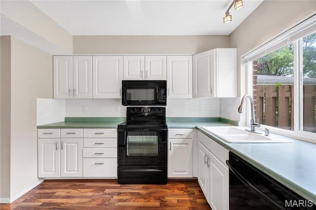 13489 Beaulac Dr, Chesterfield, MO 63141 - kitchen with black appliances, a sink, white cabinetry, and dark wood finished floors