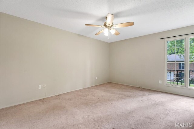 13489 Beaulac Dr, Chesterfield, MO 63141 - carpeted spare room featuring a ceiling fan, baseboards, and a textured ceiling