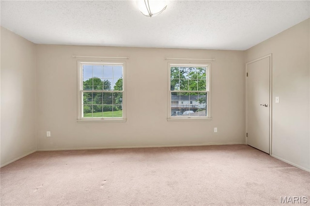 13489 Beaulac Dr, Chesterfield, MO 63141 - unfurnished room with carpet flooring, a textured ceiling, and baseboards