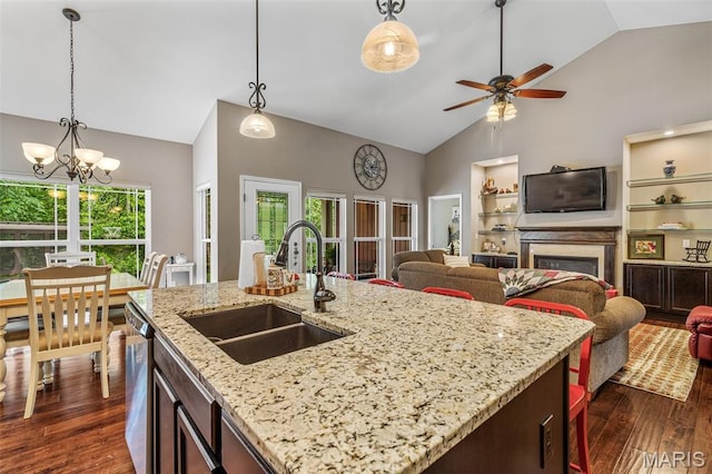 1930 Masters Dr, Festus, MO 63028 - kitchen with a sink, open floor plan, dark wood-style floors, dishwasher, and high vaulted ceiling