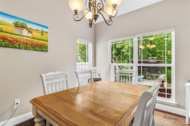 1930 Masters Dr, Festus, MO 63028 - dining room with a chandelier, baseboards, and wood finished floors