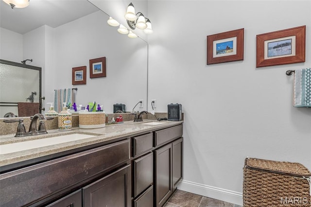 1930 Masters Dr, Festus, MO 63028 - bathroom featuring double vanity, baseboards, a stall shower, and tile patterned floors