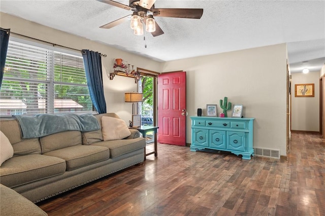 1505 Mulberry St, Jackson, MO 63755 - living area featuring a textured ceiling, wood finished floors, and a ceiling fan