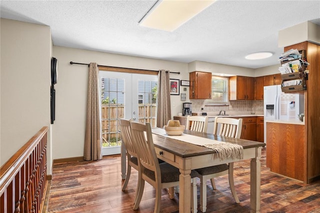1505 Mulberry St, Jackson, MO 63755 - dining room with dark wood-style floors, a textured ceiling, baseboards, and french doors
