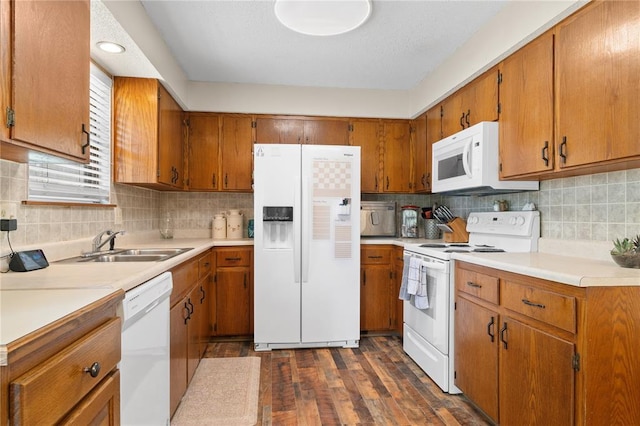 1505 Mulberry St, Jackson, MO 63755 - kitchen featuring white appliances, a sink, brown cabinetry, and backsplash