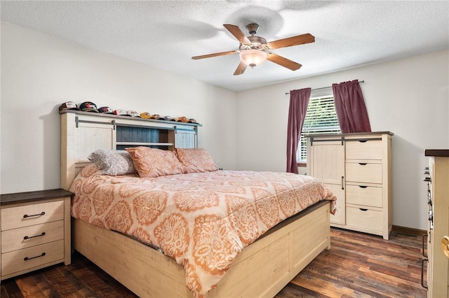 1505 Mulberry St, Jackson, MO 63755 - bedroom with dark wood-style floors, a textured ceiling, and a ceiling fan