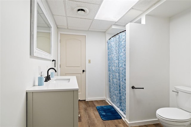 1505 Mulberry St, Jackson, MO 63755 - full bathroom with vanity, toilet, wood finished floors, a paneled ceiling, and a shower with shower curtain