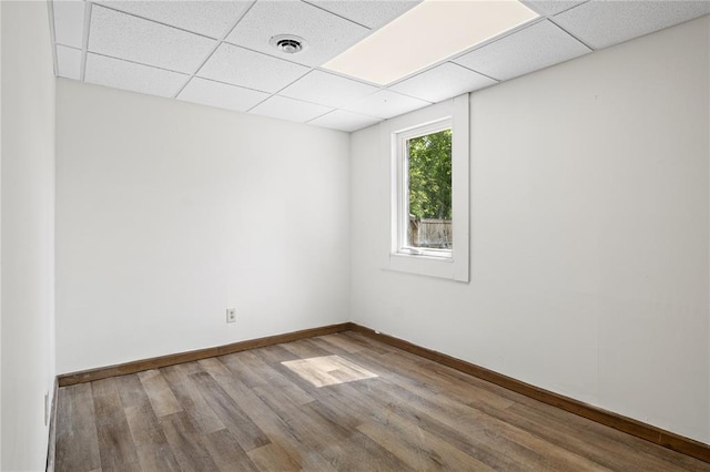 1505 Mulberry St, Jackson, MO 63755 - spare room featuring a drop ceiling, wood finished floors, and baseboards