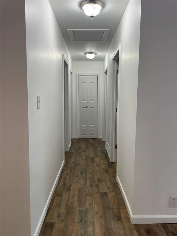 13103 Old 79, New London, MO 63459 - corridor with attic access, dark wood finished floors, and baseboards