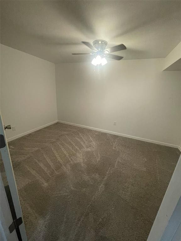 13103 Old 79, New London, MO 63459 - unfurnished room featuring a ceiling fan, dark carpet, and baseboards