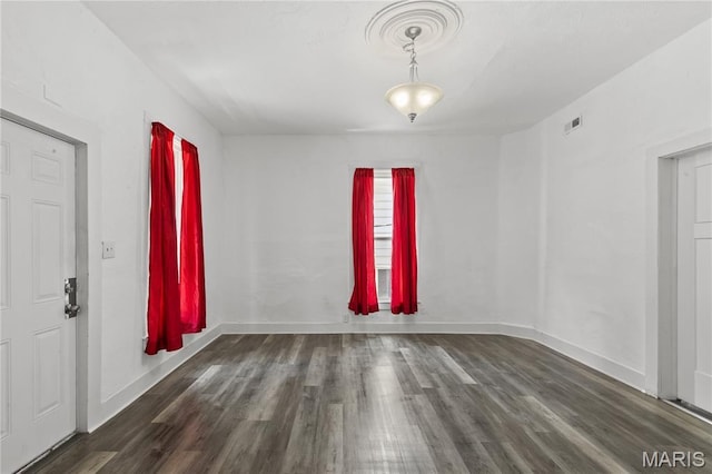 1217 E 5th St, Alton, IL 62002 - unfurnished room with wood finished floors and baseboards
